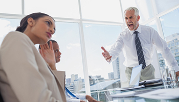 Furious boss yelling at colleagues